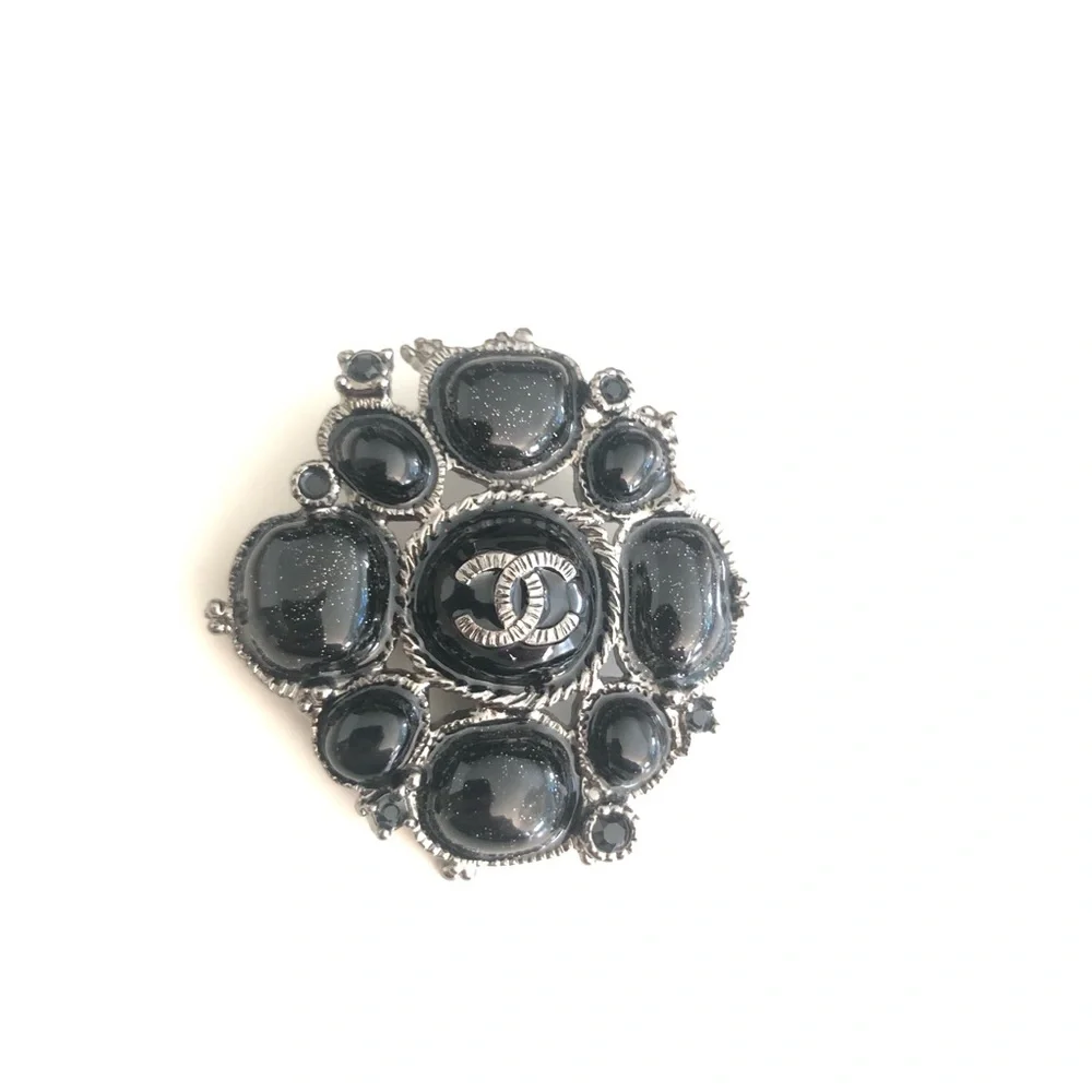 CHANEL Black Camellia Brooch - Signature Logo Accent